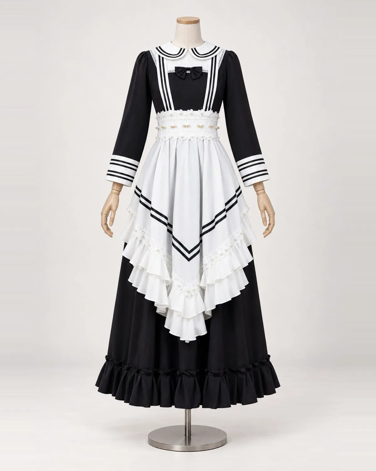 Colette Rayée — Black and White Striped Apron Dress — shown on a mannequin, front product view