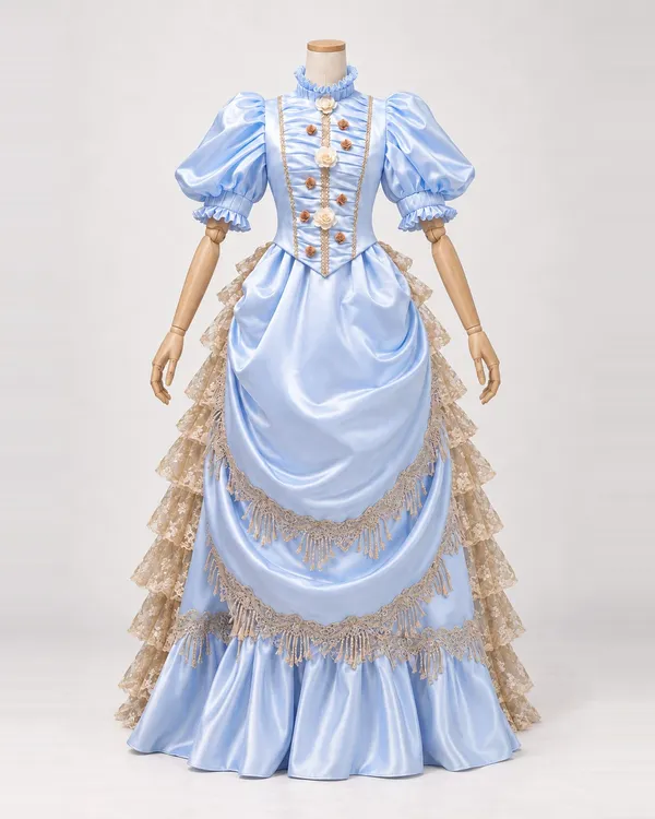 Hortense Céleste — Pale Blue Satin-Look Gown with Rosettes and Fringe