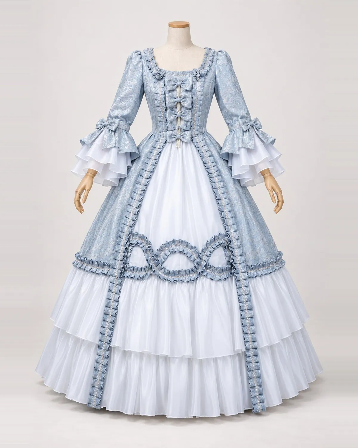 Giselle Givrée — Silver Blue Gown with Bow and Loop Trim — shown on a mannequin, front product view