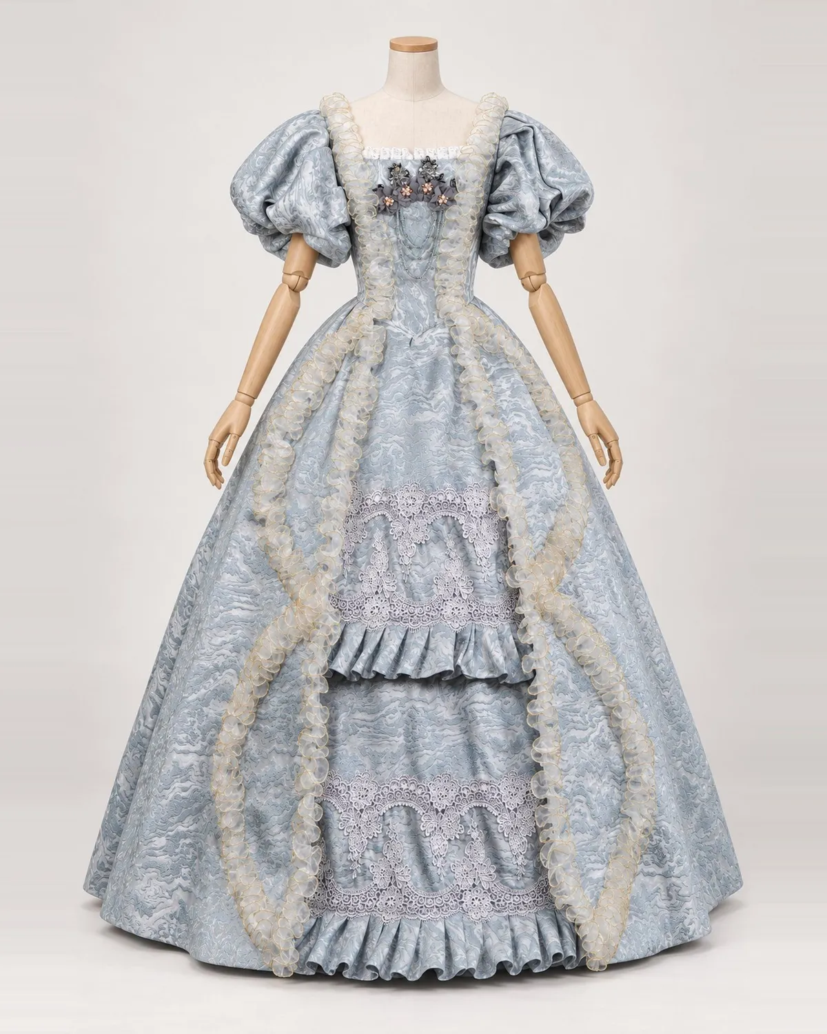 Brume Ciselée — Silver Blue Patterned Gown with Ruffled Front — shown on a mannequin, front product view