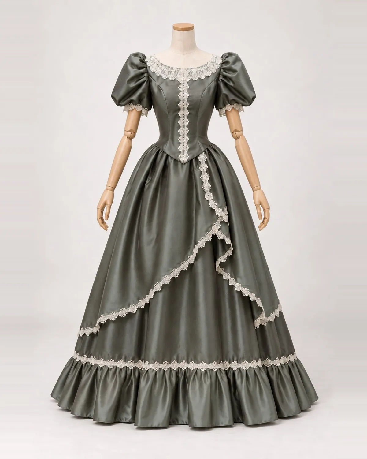 Saule Discret — Grey-Green Satin-Look Gown with Asymmetric Lace Edging — shown on a mannequin, front product view