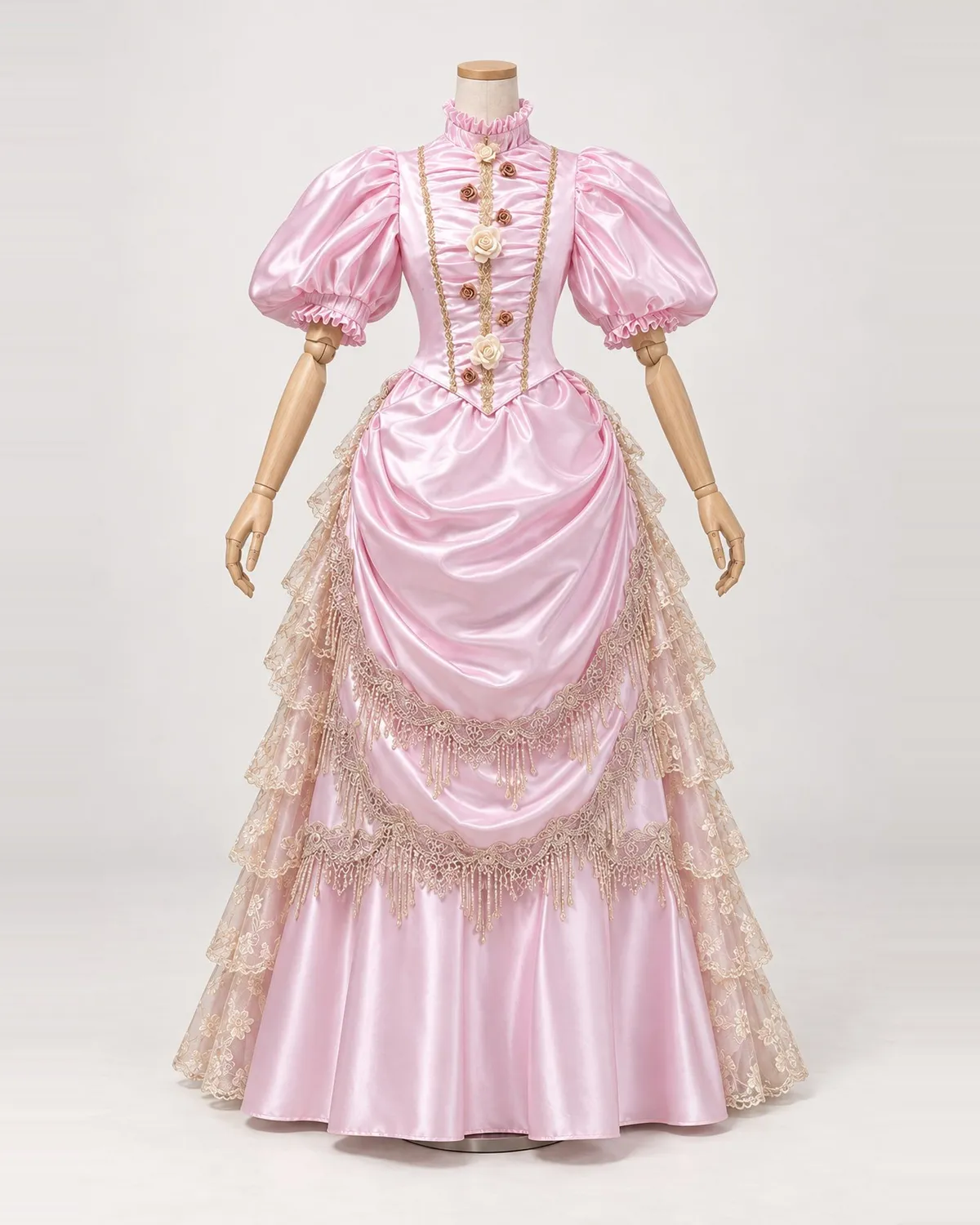 Dragée Rosée — Pink Satin-Look Gown with Rose Accents and Fringed Swags — shown on a mannequin, front product view
