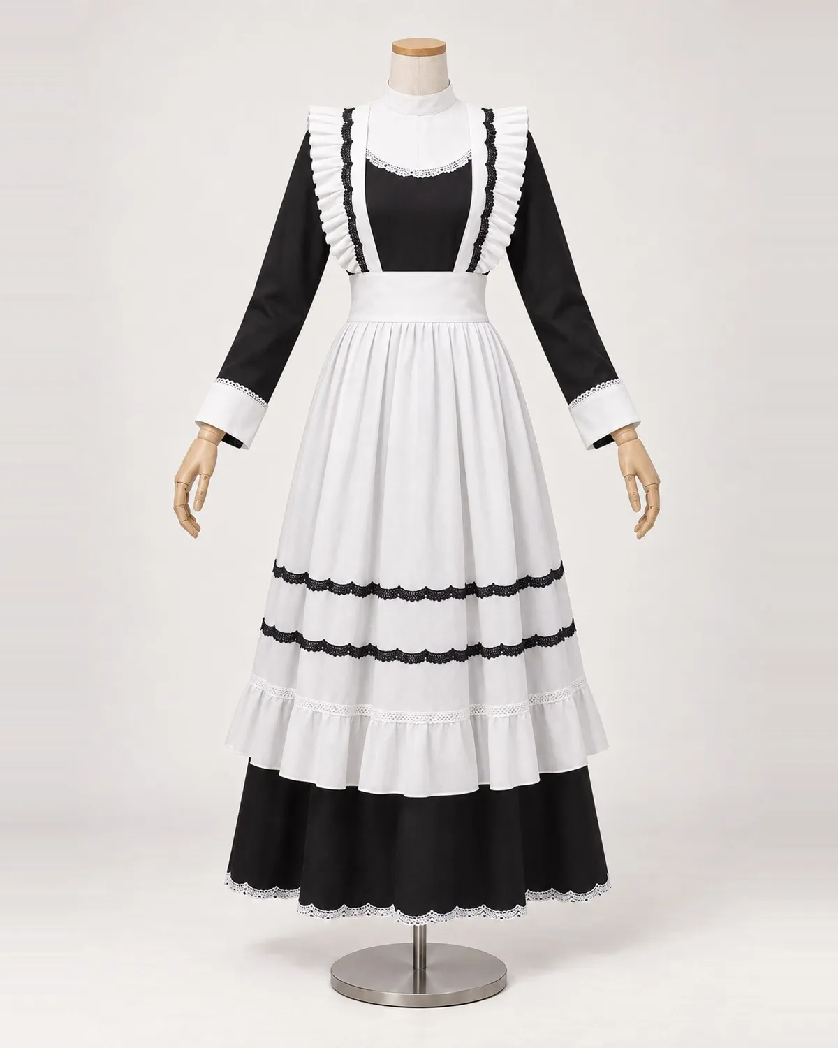 Blanche Cadence — Black and White Lace-Trimmed Apron Dress — shown on a mannequin, front product view