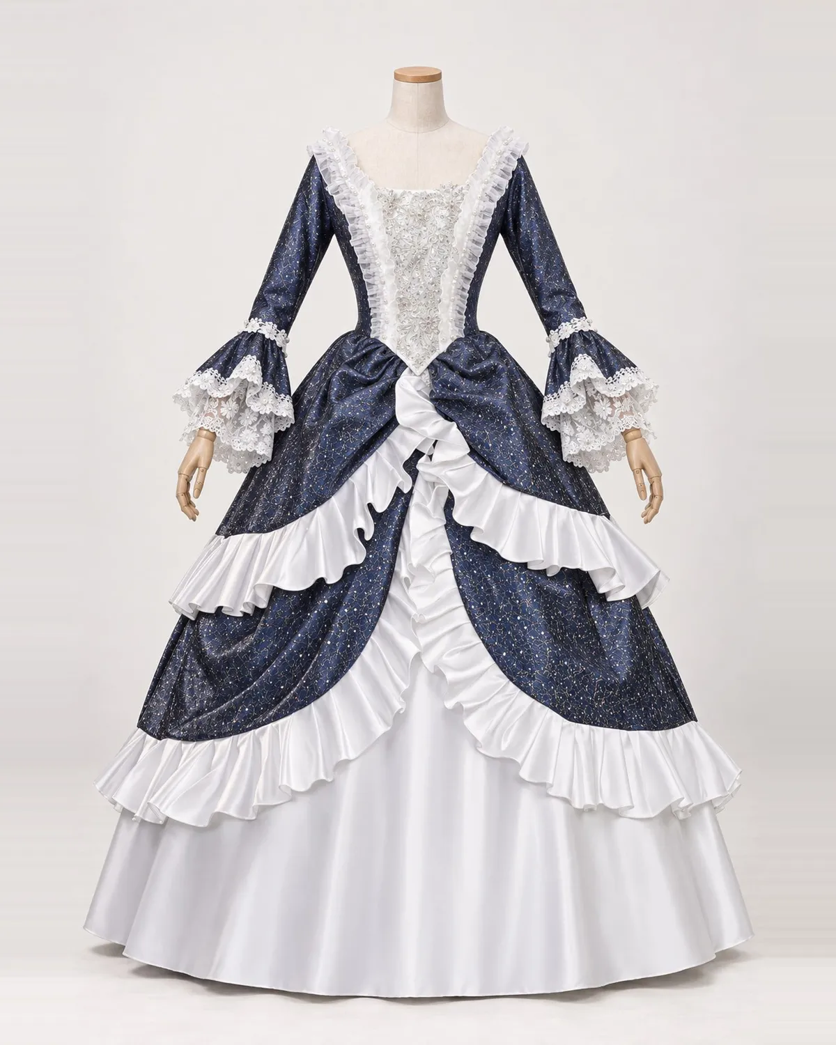 Constellation Bleue — Navy and White Gown with Gold-Speckled Drapes — shown on a mannequin, front product view
