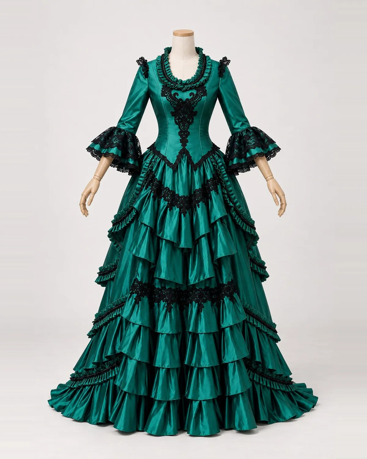 Sylve Enchantée — Emerald Satin-Look Gown with Black Lace and Cascading Tiers — shown on a mannequin, front product view
